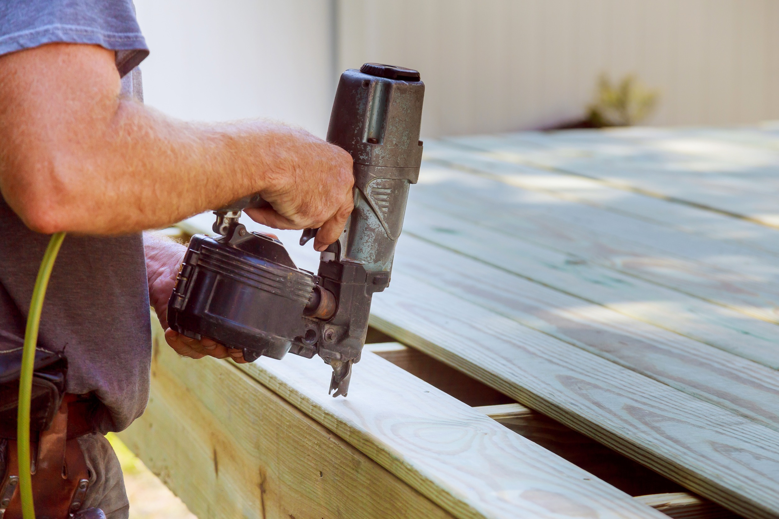 Handyman repairing deck