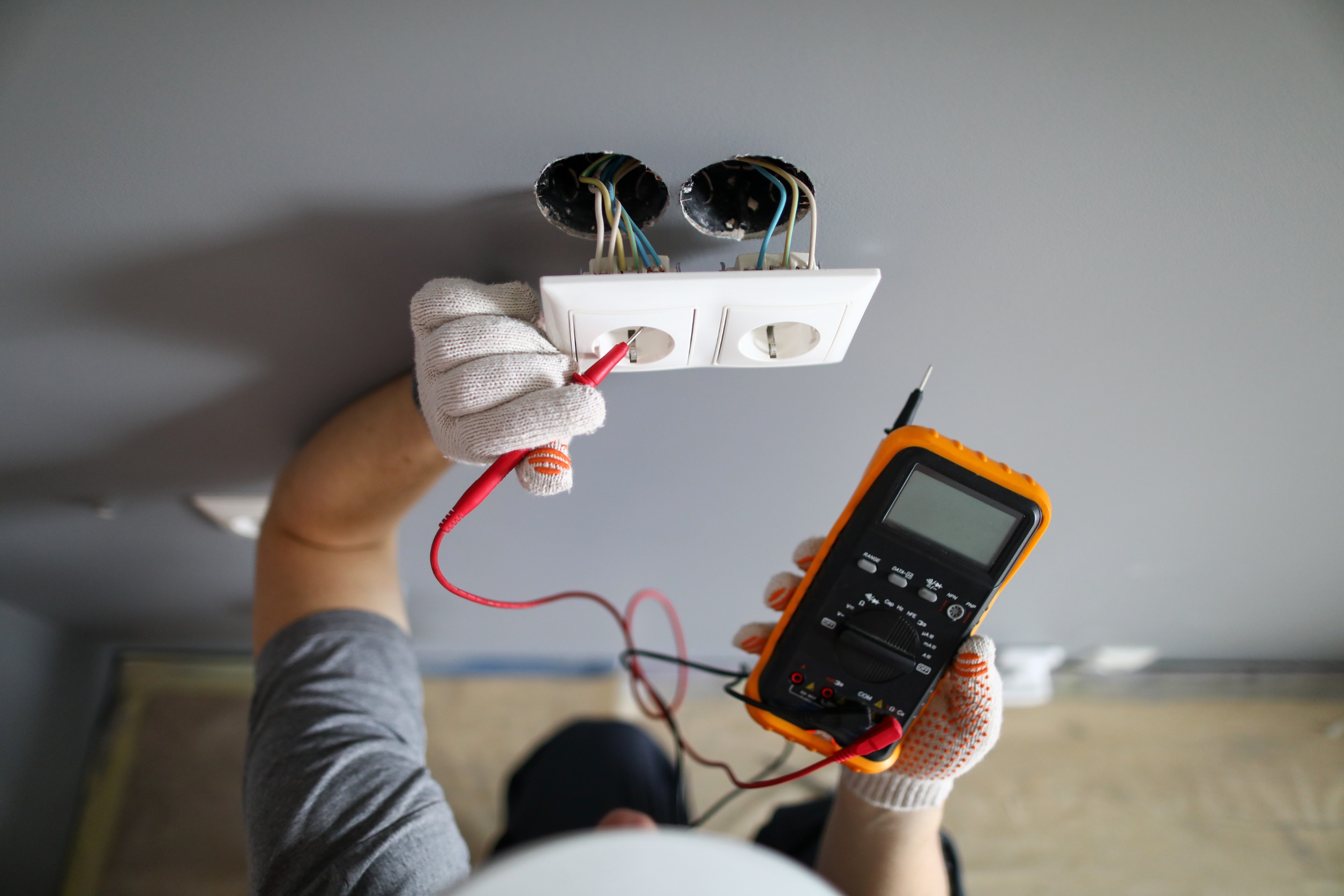 Handyman repairing an electrical outlet